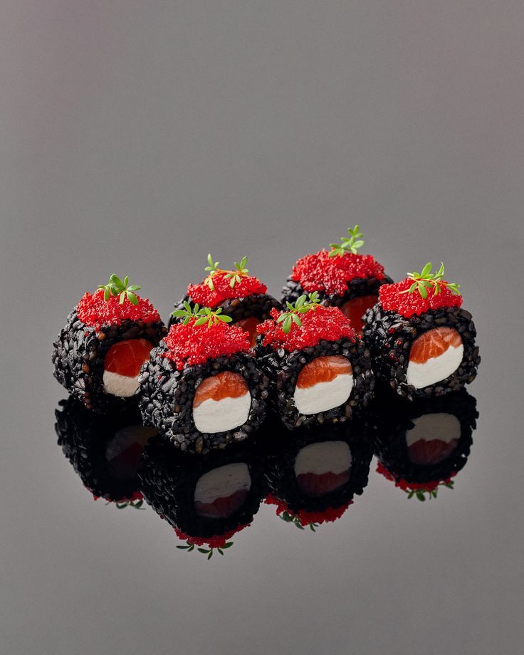 Black rice sushi rolls with salmon and roe